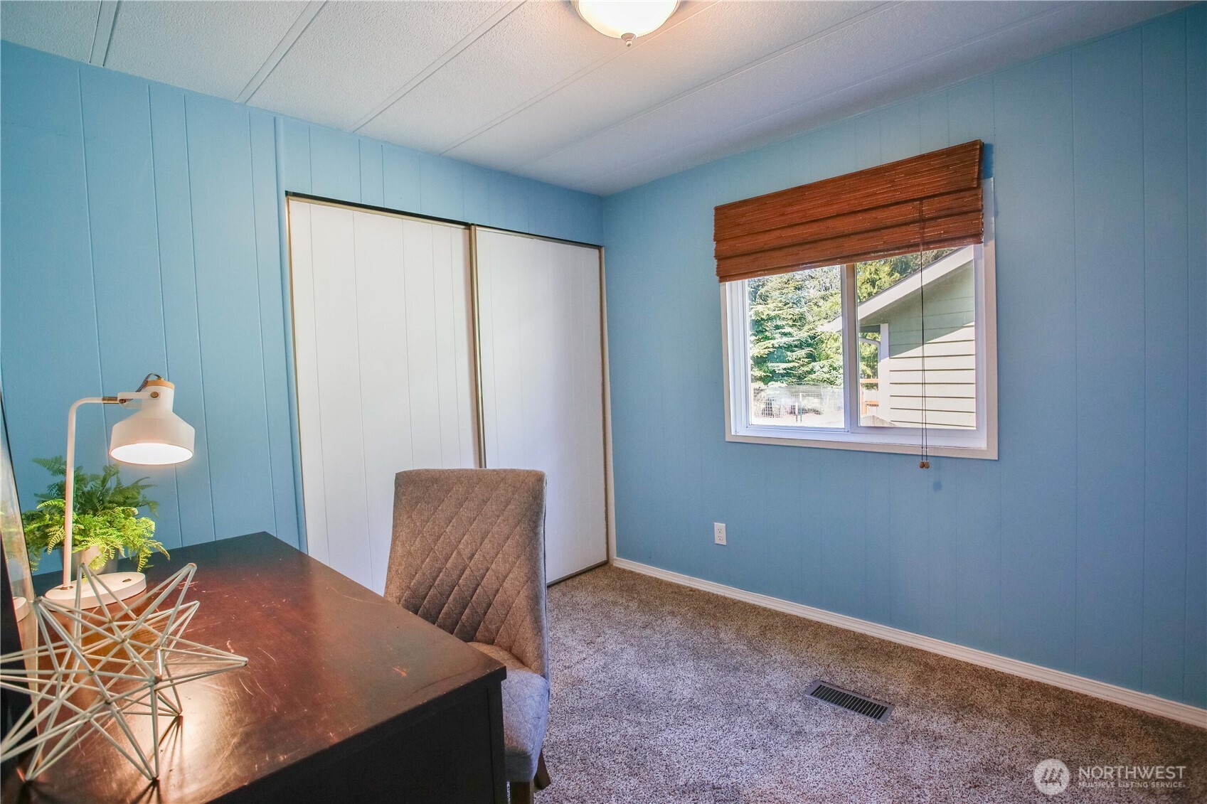 3276 East Harbor Road Langley, WA 98260 - Photo 27 of 37 a living room with furniture and a window