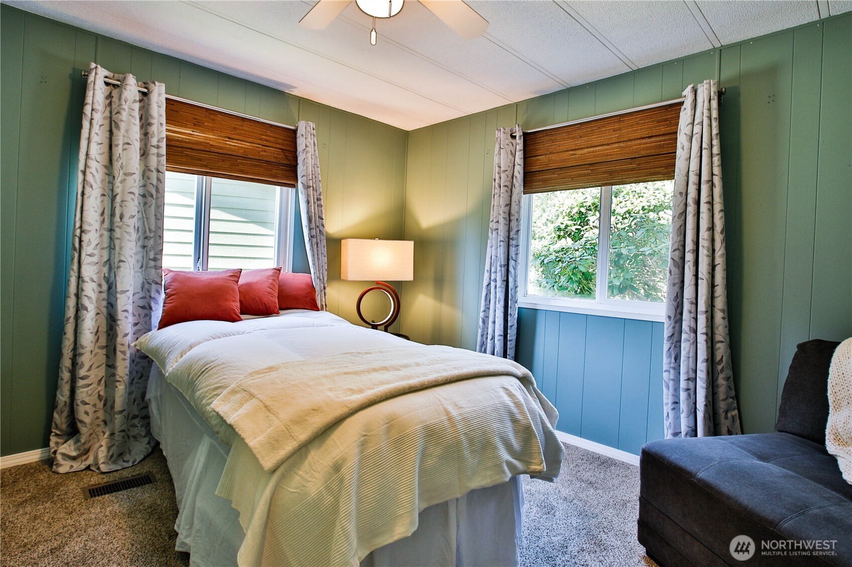 3276 East Harbor Road Langley, WA 98260 - Photo 29 of 37 a bedroom with a bed and wooden floor