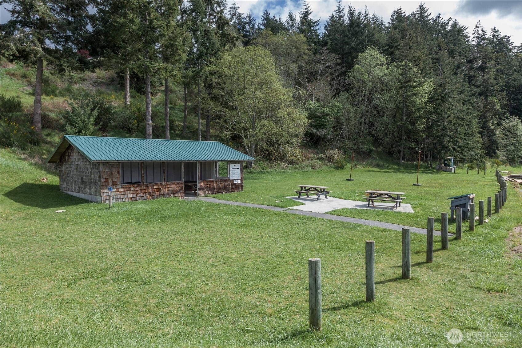 3276 East Harbor Road Langley, WA 98260 - Photo 36 of 37 a view of a house with a backyard porch and sitting area
