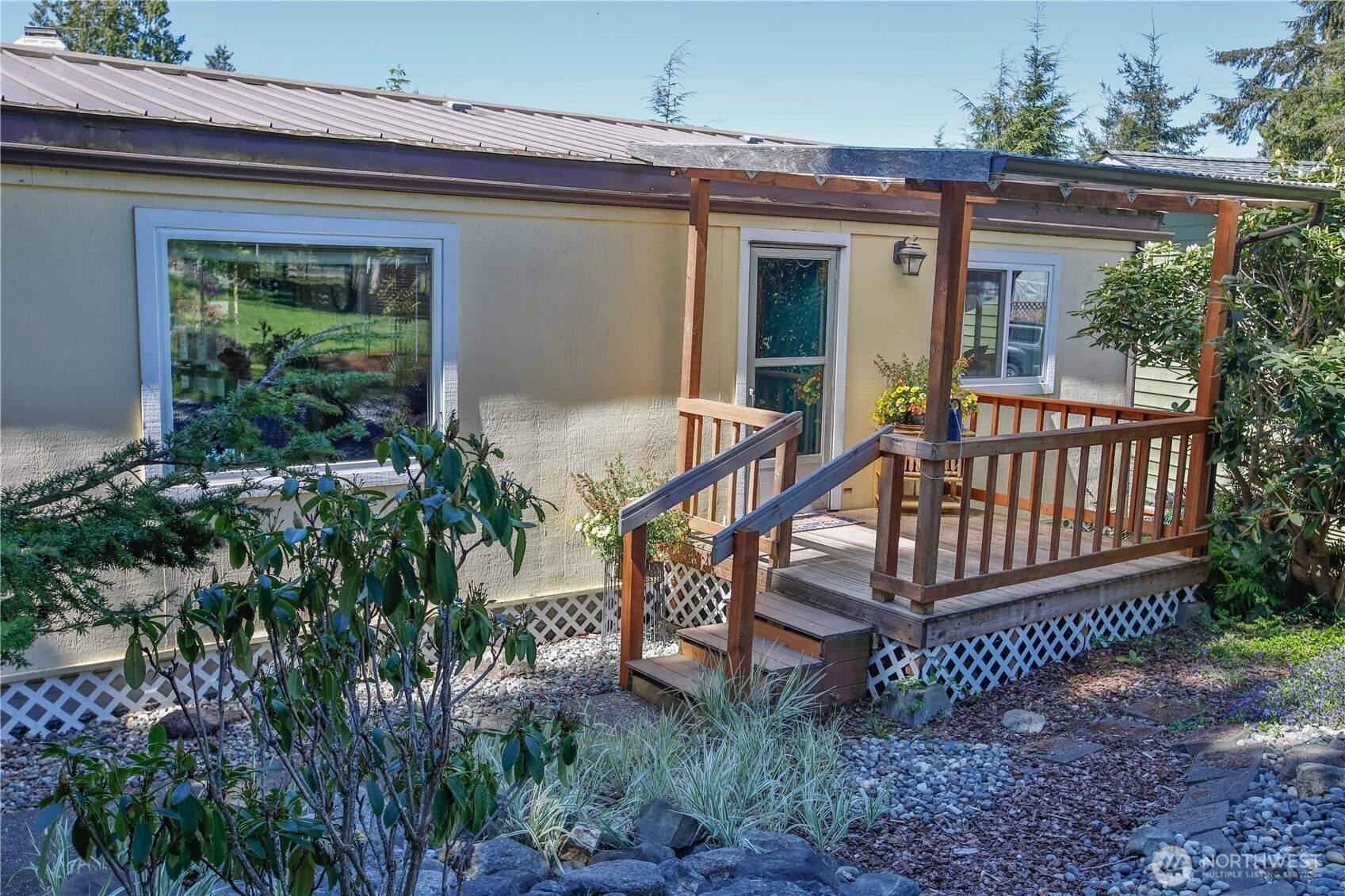 3276 East Harbor Road Langley, WA 98260 - Photo 4 of 37 a view of a house with backyard and sitting area