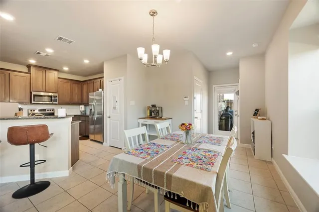 a living room with stainless steel appliances kitchen island granite countertop furniture a kitchen island a stove and a sink