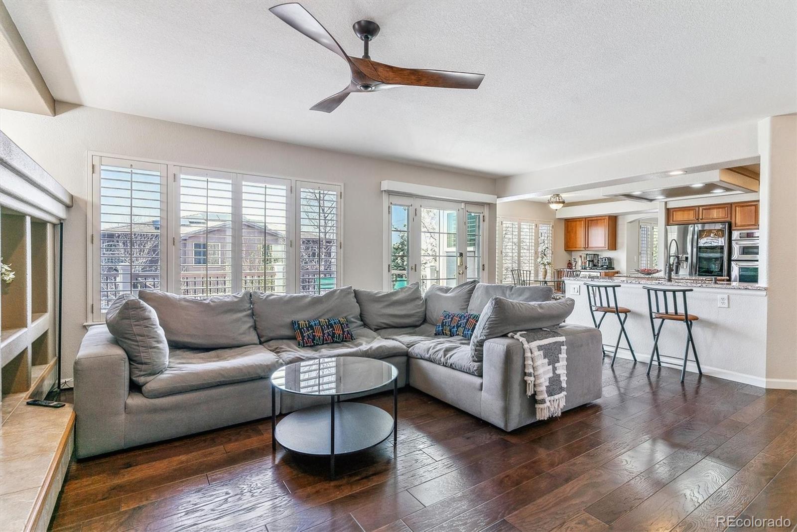 9109 South Ironwood Way Highlands Ranch, CO 80129 - Photo 18 of 49 a living room with furniture and a large window
