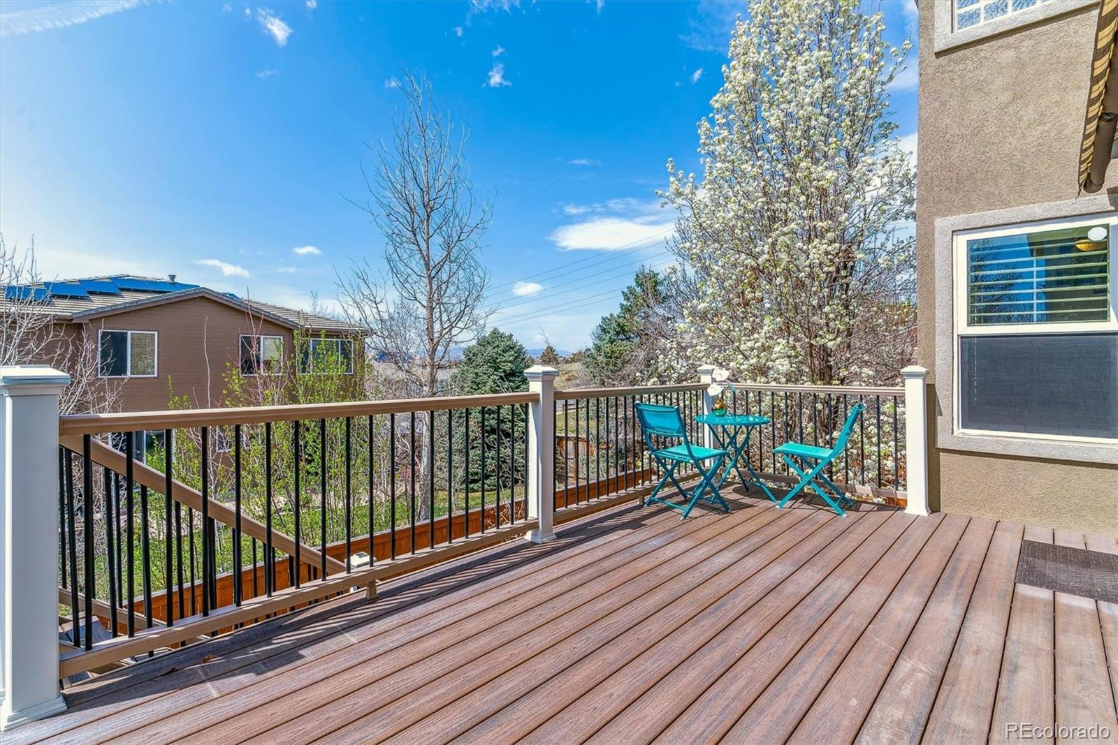 9109 South Ironwood Way Highlands Ranch, CO 80129 - Photo 19 of 49 a view of a balcony with wooden floor and fence