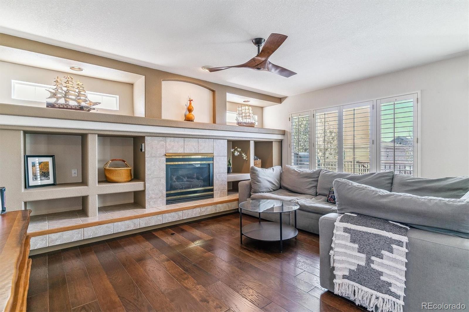 9109 South Ironwood Way Highlands Ranch, CO 80129 - Photo 21 of 49 a living room with furniture and a large window