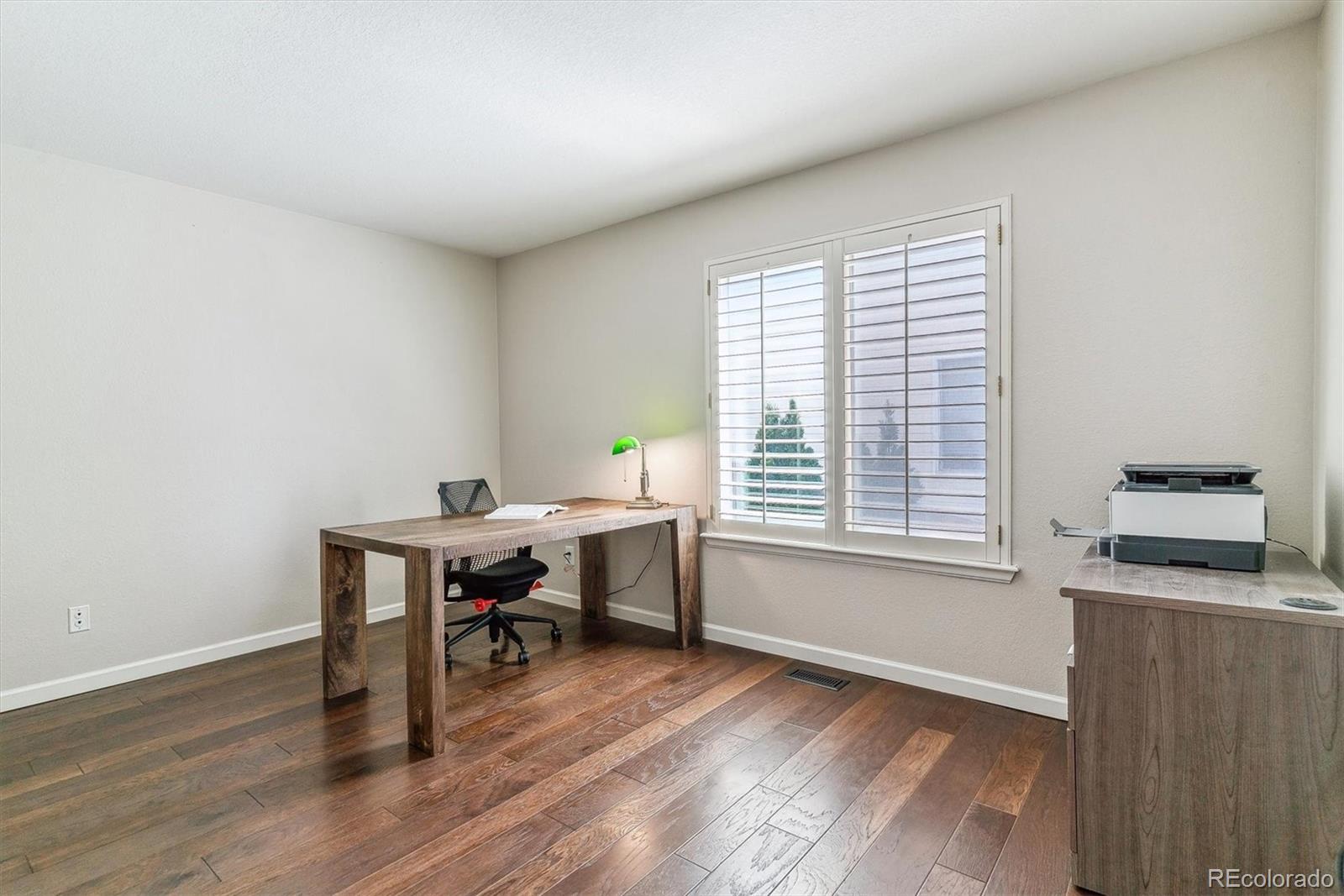 9109 South Ironwood Way Highlands Ranch, CO 80129 - Photo 22 of 49 a workspace with furniture and a window