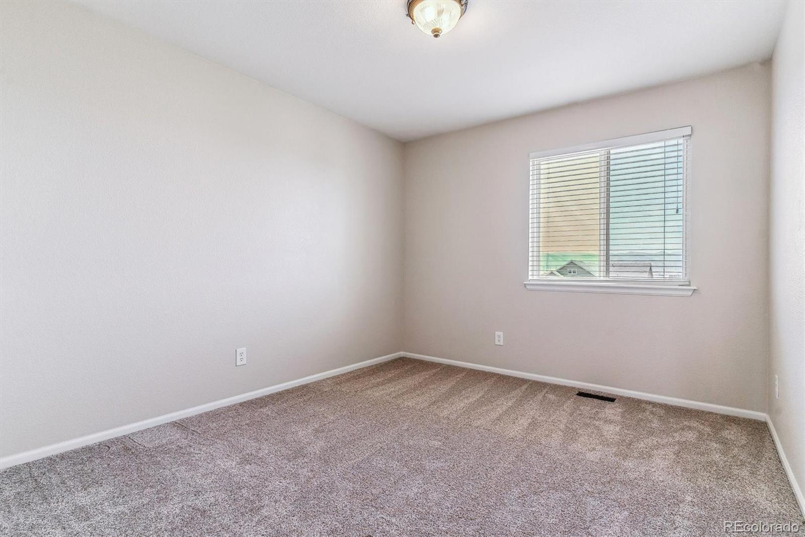 9109 South Ironwood Way Highlands Ranch, CO 80129 - Photo 34 of 49 an empty room with a window
