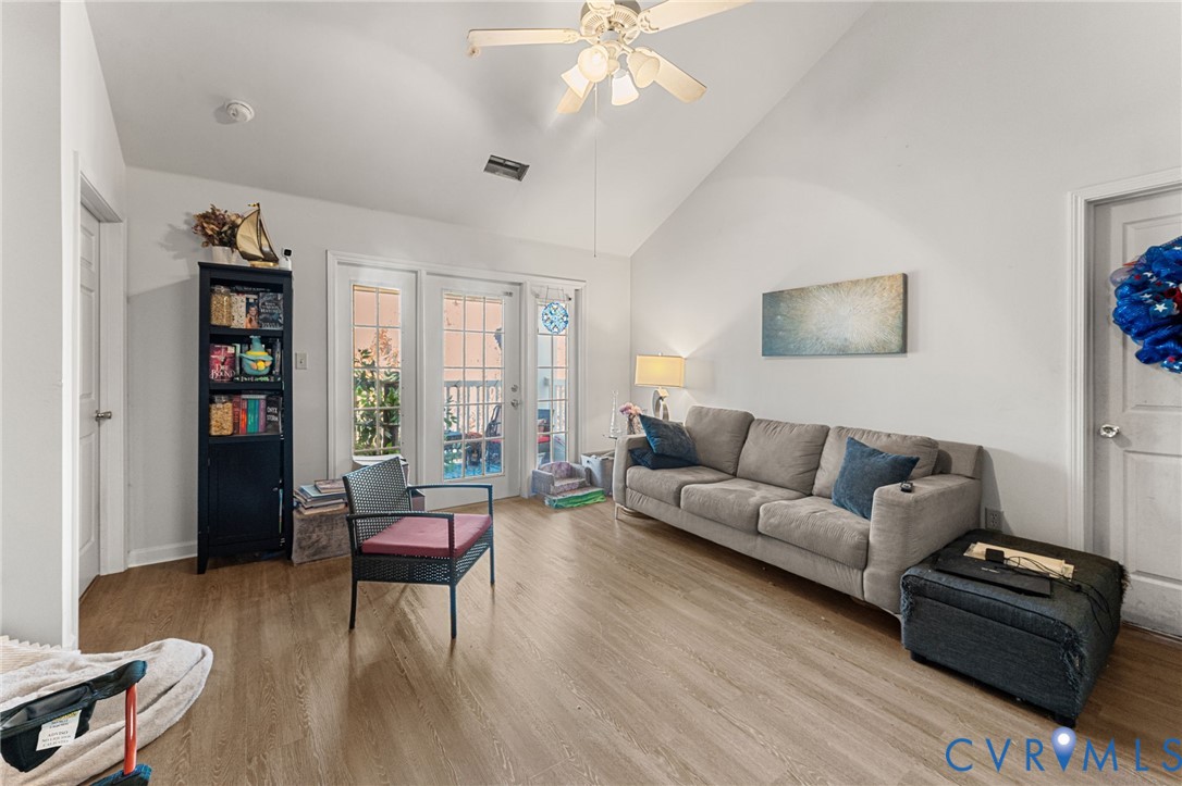 724 Bristol Village Drive, Unit 303 Midlothian, VA 23114 - Photo 3 of 14 a living room with furniture and a flat screen tv