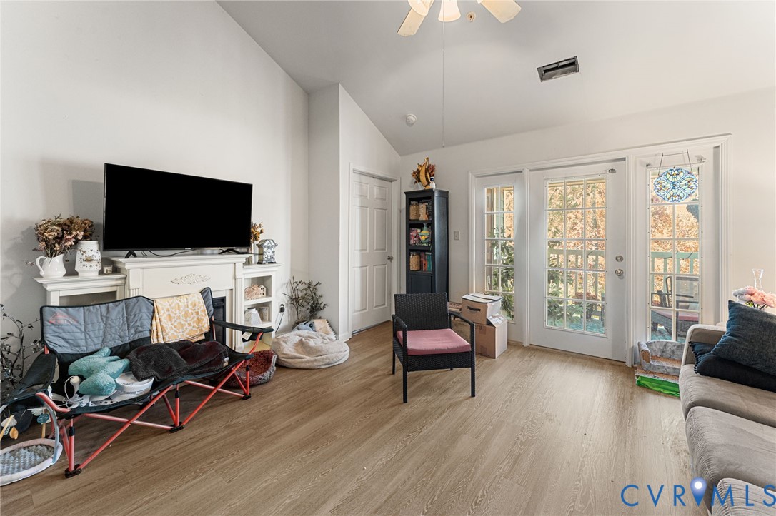 724 Bristol Village Drive, Unit 303 Midlothian, VA 23114 - Photo 4 of 14 a living room with furniture and a flat screen tv