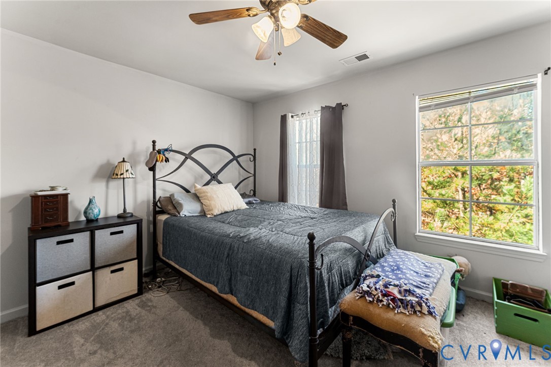 724 Bristol Village Drive, Unit 303 Midlothian, VA 23114 - Photo 5 of 14 a bedroom with bed and window