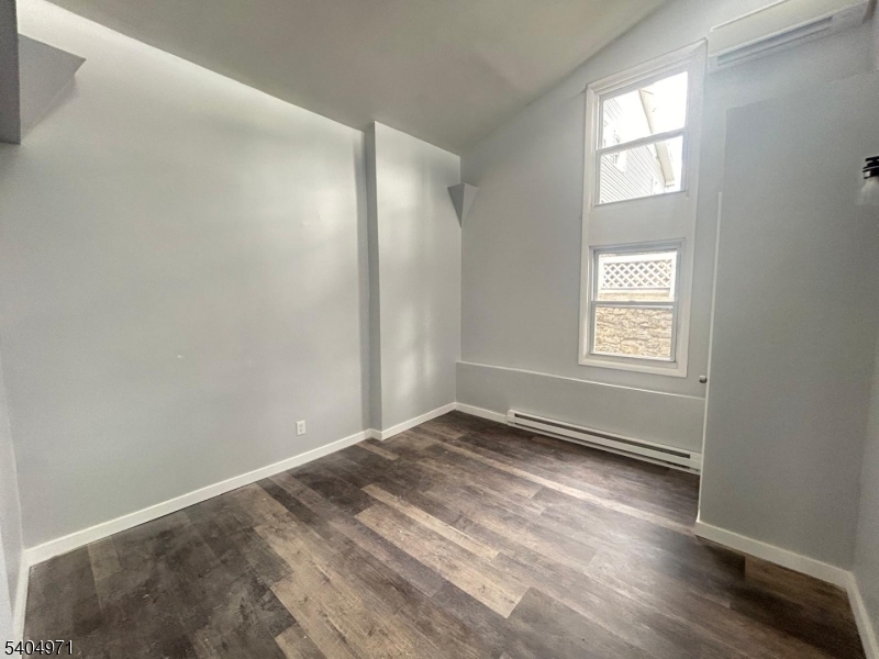 38 West River Styx Road Hopatcong, NJ 07843 - Photo 13 of 36 an empty room with wooden floor and windows