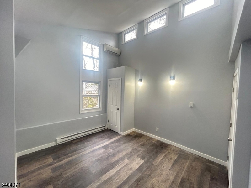 38 West River Styx Road Hopatcong, NJ 07843 - Photo 14 of 36 a view of empty room with wooden floor and fan