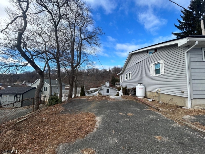 38 West River Styx Road Hopatcong, NJ 07843 - Photo 26 of 36 a view of a house with a yard