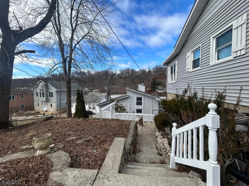 38 West River Styx Road Hopatcong, NJ 07843 - Photo 27 of 36 a view of a house with backyard and sitting area