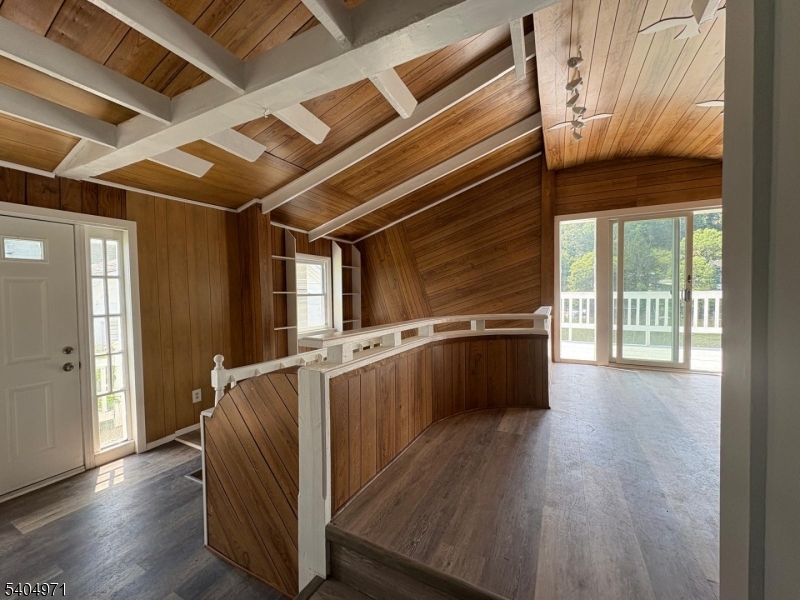 38 West River Styx Road Hopatcong, NJ 07843 - Photo 5 of 36 a view of an empty room with wooden floor and a window