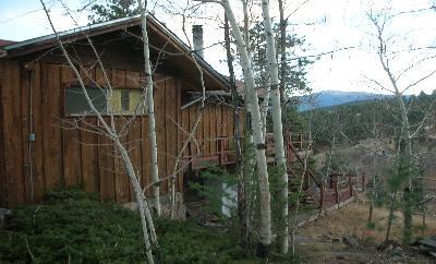 294 Catamount Ridge Road Bailey, CO 80421 - Photo 1 of 1 a view of a house with a small yard