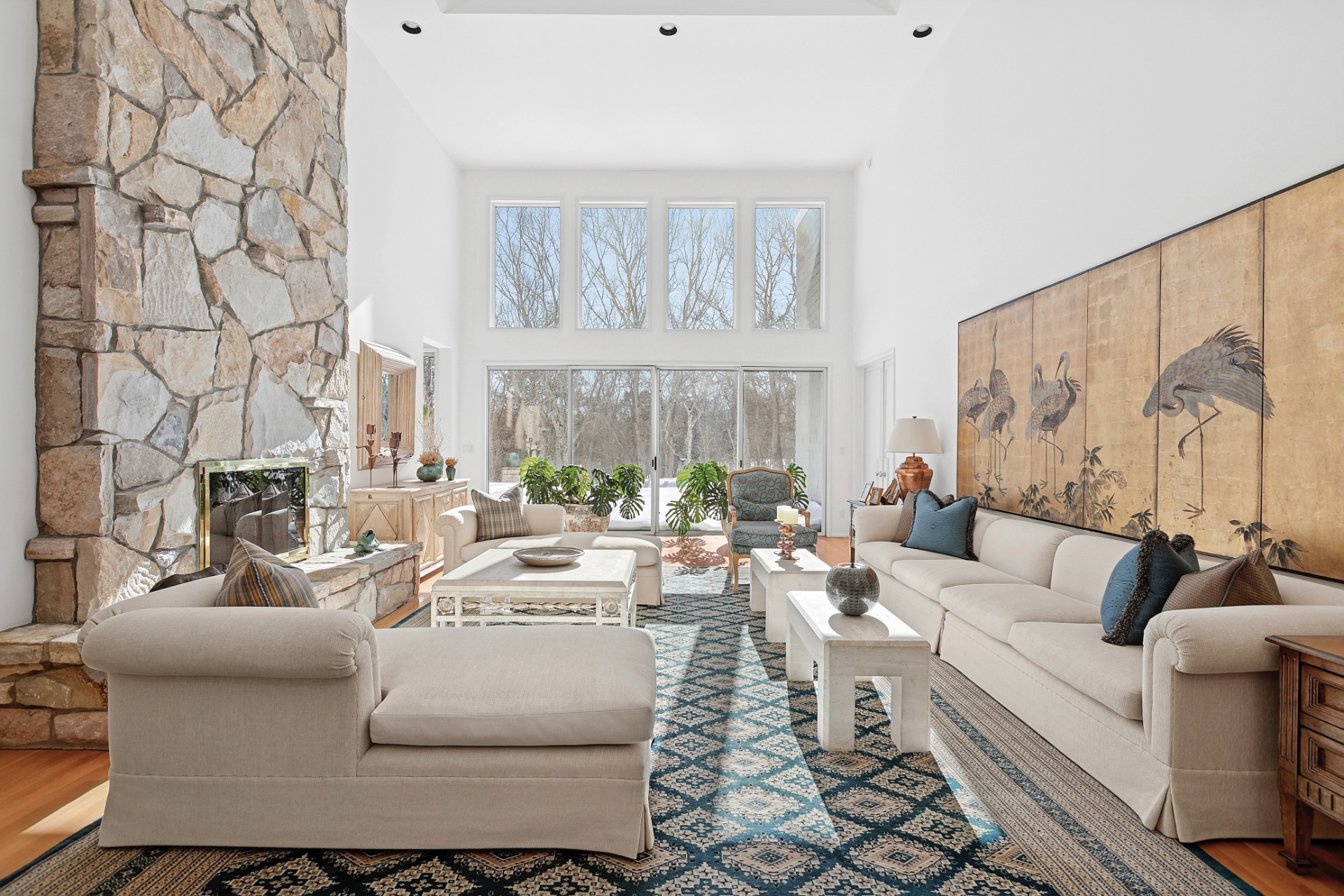 7 Chatfields Ridge Road East Hampton, NY 11937 - Photo 1 of 18 a living room with fireplace furniture and a large window