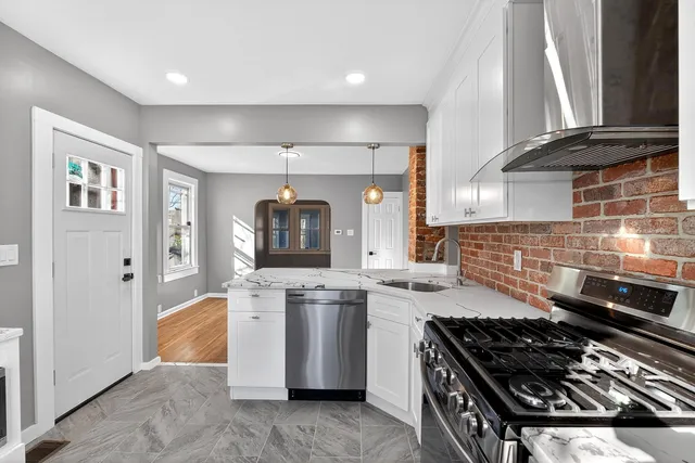 a kitchen with a stove and a refrigerator