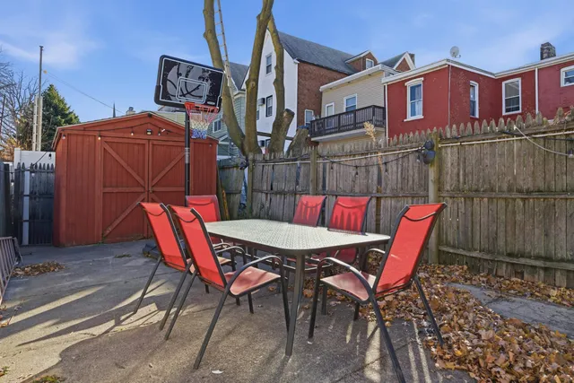 a view of a chairs and table in patio