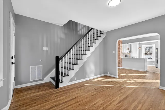 a view of an entryway with wooden floor