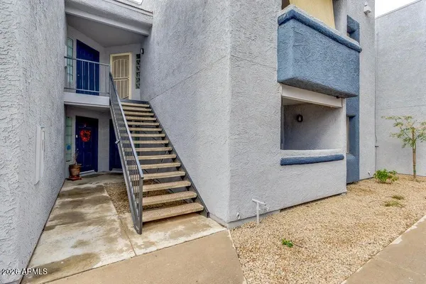 a view of a staircase and white walls