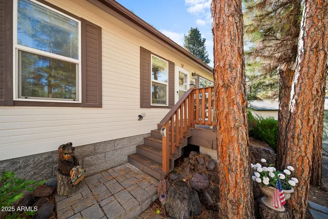 a view of balcony with wooden floor and fence