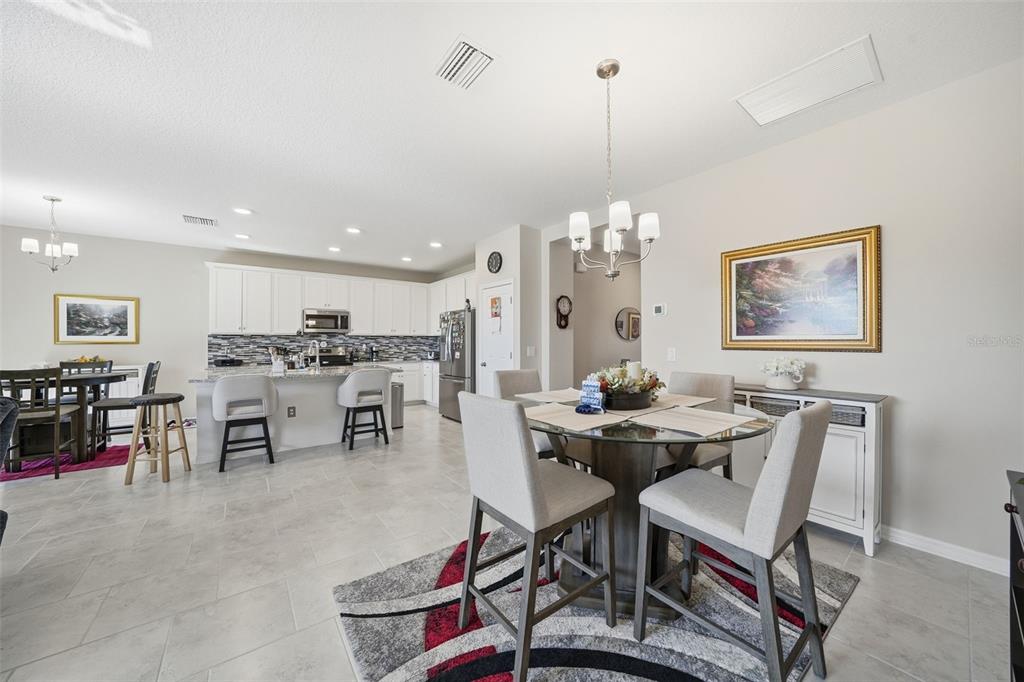 220 Hillshire Place Spring Hill, FL 34609 - Photo 12 of 18 a dining room with furniture and window