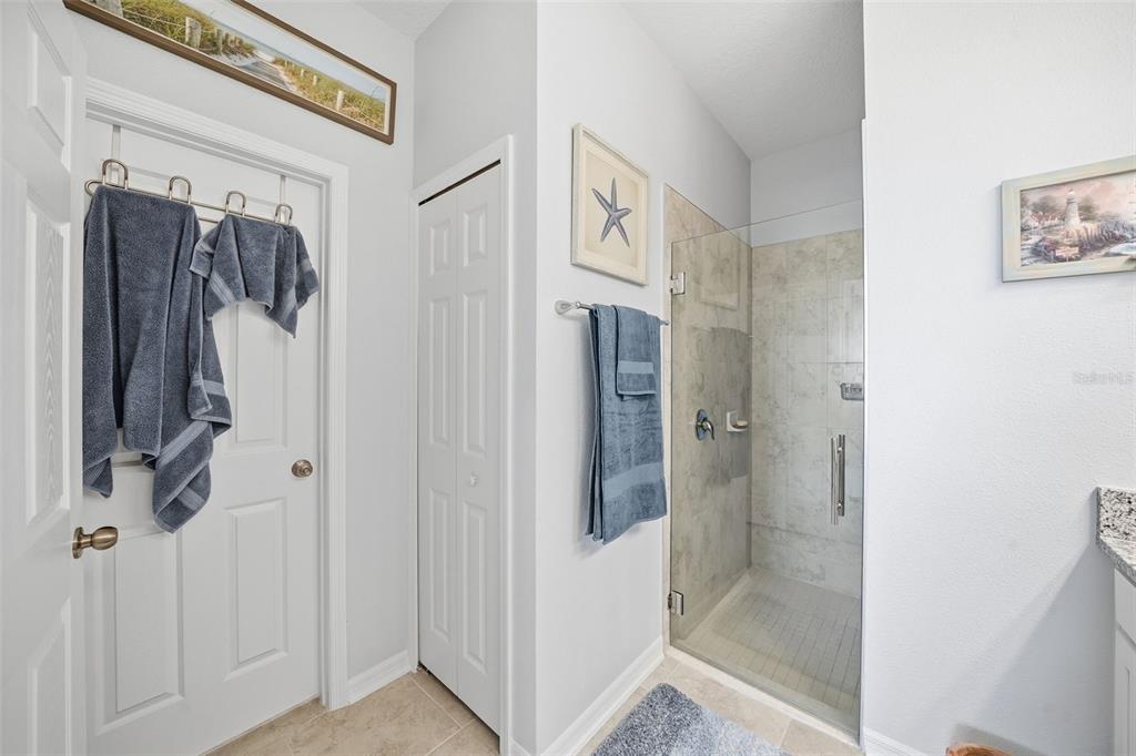 220 Hillshire Place Spring Hill, FL 34609 - Photo 16 of 18 a bathroom with a shower