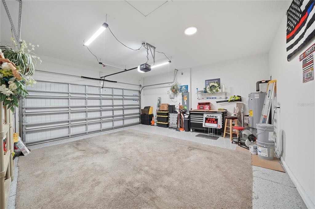 220 Hillshire Place Spring Hill, FL 34609 - Photo 18 of 18 a view of a livingroom with furniture and a garage
