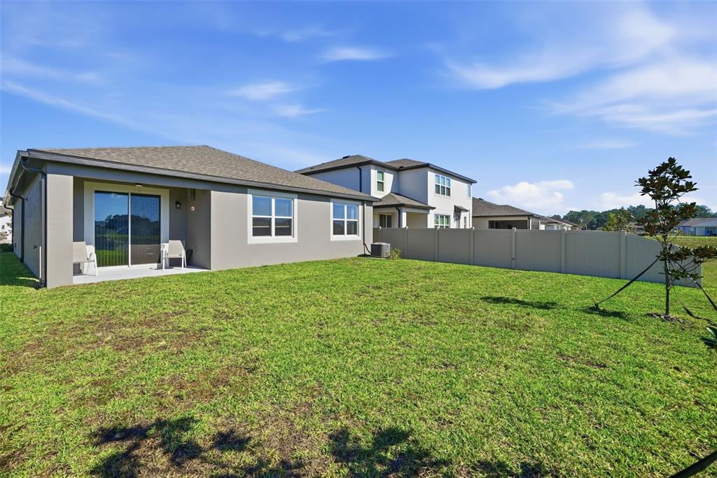220 Hillshire Place Spring Hill, FL 34609 - Photo 4 of 18 a front view of a house with a yard