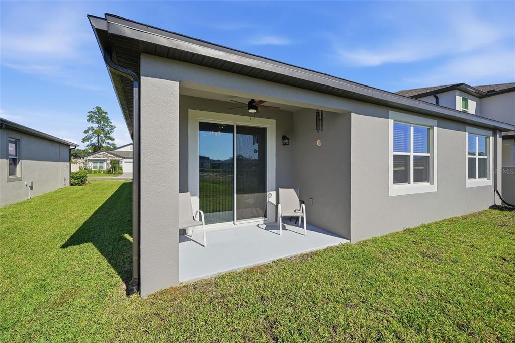 220 Hillshire Place Spring Hill, FL 34609 - Photo 5 of 18 a view of backyard with a large tree