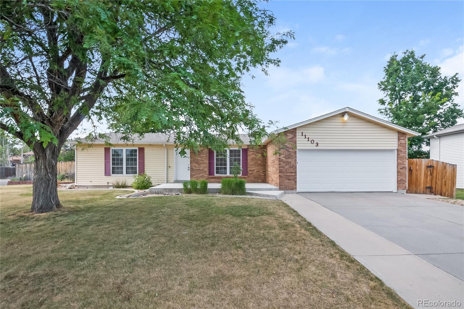 11103 Eudora Circle Thornton, CO 80233 - Photo 1 of 17 a view of a house with a yard and large tree