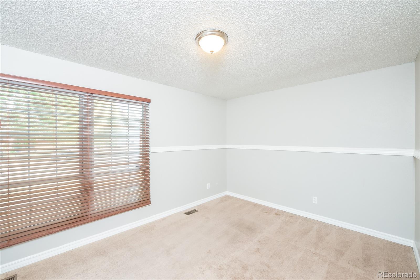 11103 Eudora Circle Thornton, CO 80233 - Photo 11 of 17 a view of an empty room with a window