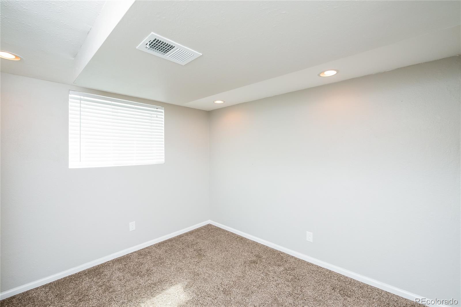 11103 Eudora Circle Thornton, CO 80233 - Photo 10 of 17 an empty room with a window