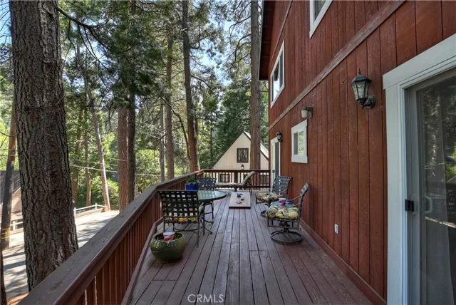 a view of balcony and deck with wooden floor and outdoor space