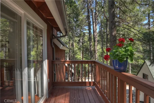 a view of a balcony with wooden floor