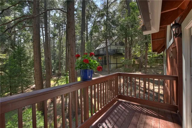 a view of a balcony with wooden floor