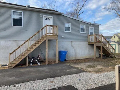 a view of a house with wooden stairs