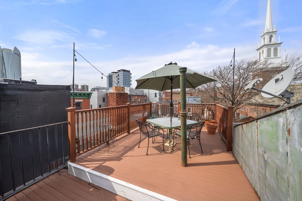 26 Unity Street, Unit 1 Boston, MA 02113 - Photo 25 of 27 a view of a terrace with chairs