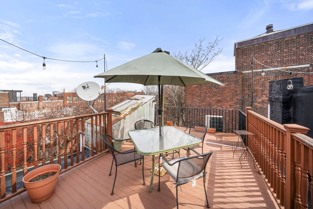 26 Unity Street, Unit 1 Boston, MA 02113 - Photo 27 of 27 a balcony with table and chairs