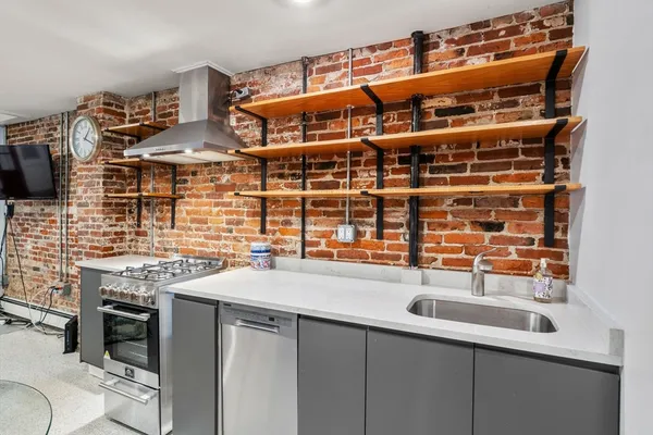 a kitchen with a sink and a stove