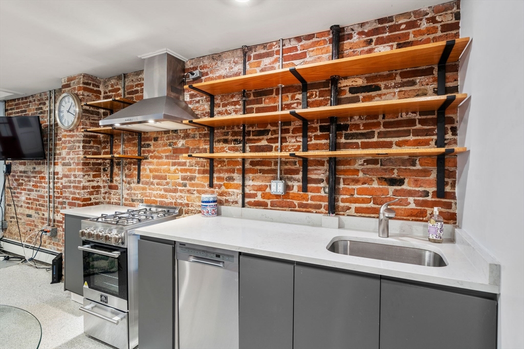 26 Unity Street, Unit 1 Boston, MA 02113 - Photo 3 of 27 a kitchen with a sink and a stove
