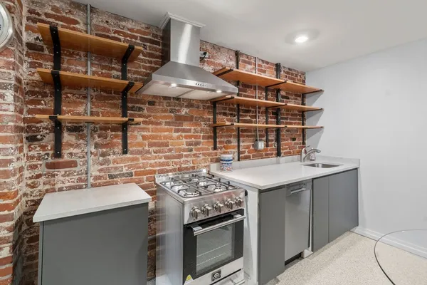 a kitchen with a stove and a microwave
