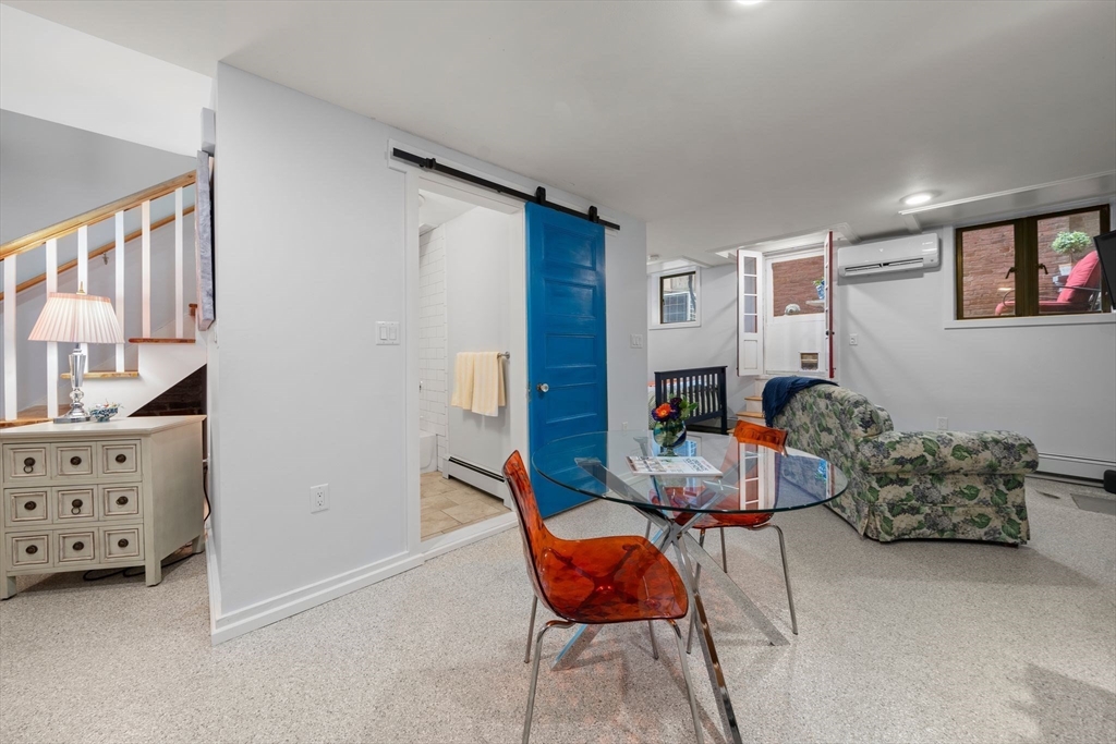 26 Unity Street, Unit 1 Boston, MA 02113 - Photo 8 of 27 a room with furniture and a wooden floor