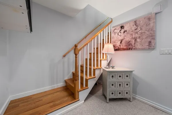 a view of a hallway with seating area
