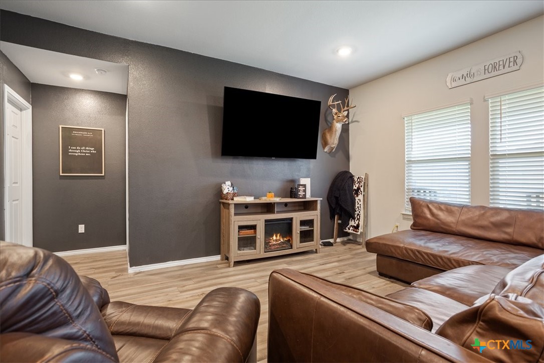 1000 Velvet Court Troy, TX 76579 - Photo 5 of 25 a bedroom with a bed and a flat screen tv