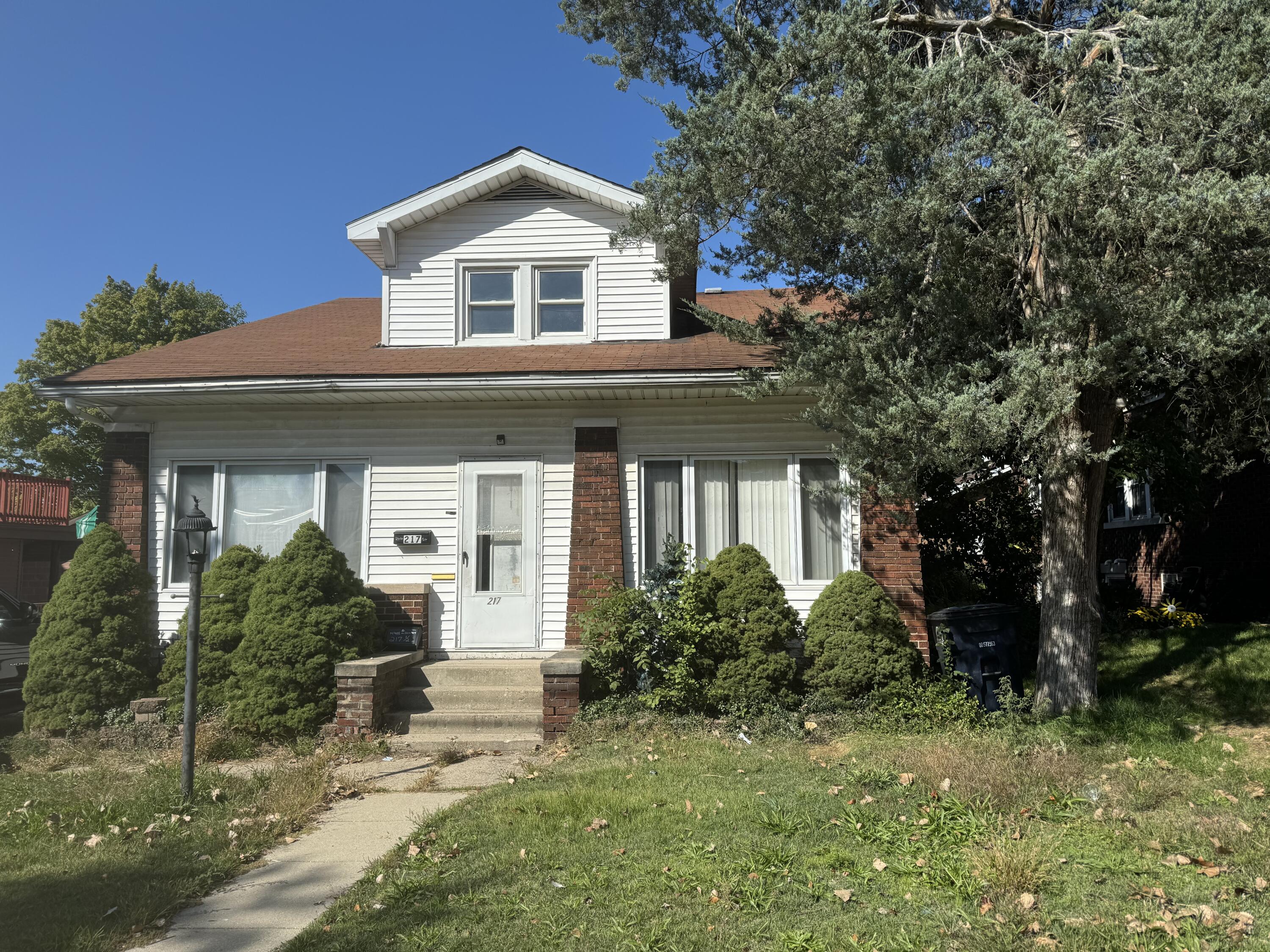 217 West Ripley Street Michigan City, IN 46360 - Photo 1 of 28 a front view of a house with a yard