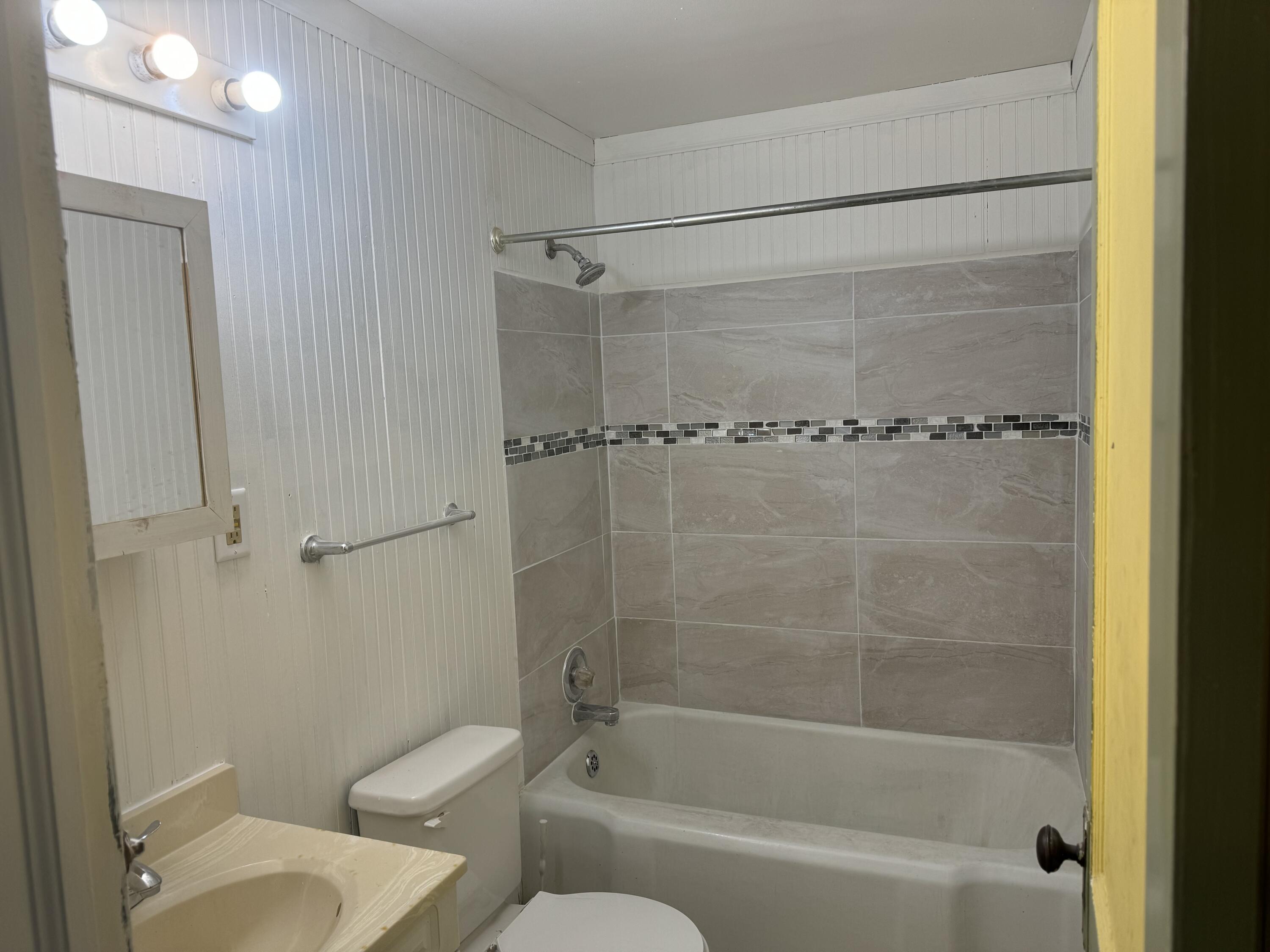 217 West Ripley Street Michigan City, IN 46360 - Photo 22 of 28 a bathroom with a shower and a toilet
