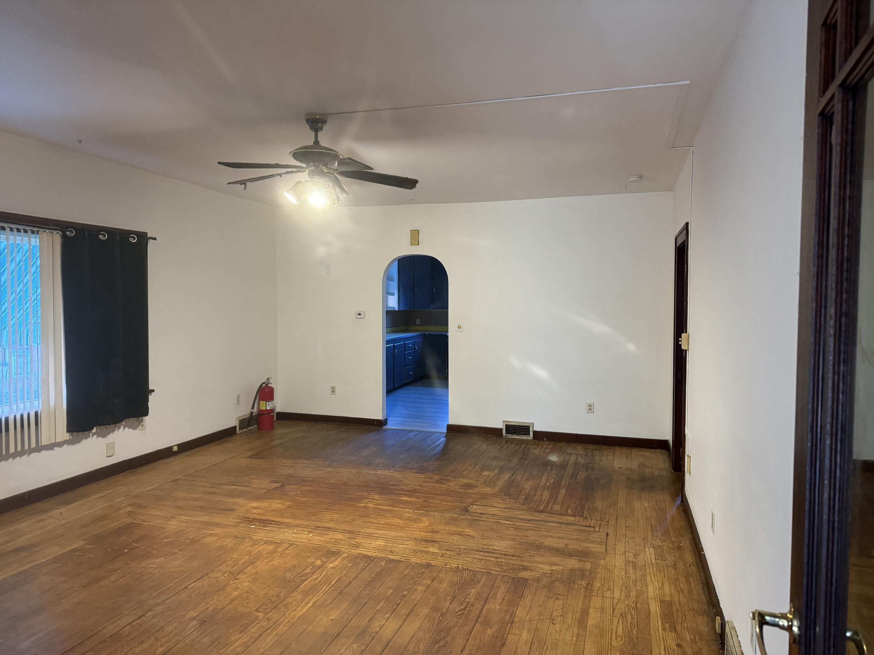217 West Ripley Street Michigan City, IN 46360 - Photo 4 of 28 a view of empty room with ceiling fan