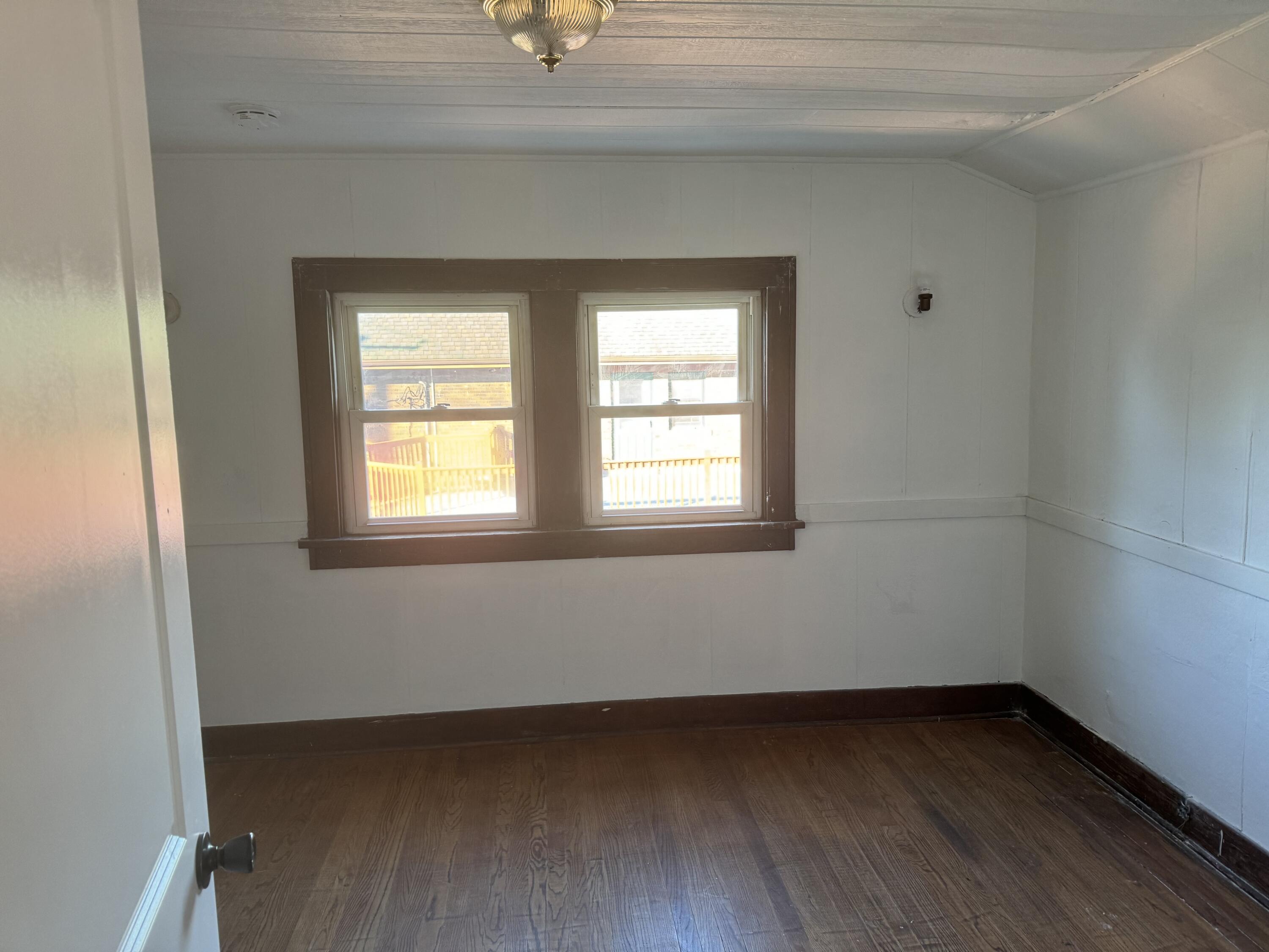 217 West Ripley Street Michigan City, IN 46360 - Photo 8 of 28 an empty room with a window