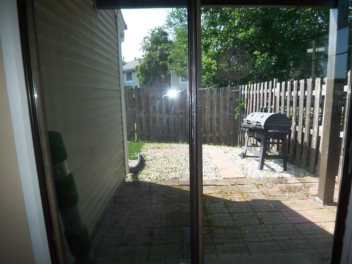 1925 Georgetown Lane Hoffman Estates, IL 60169 - Photo 14 of 29 a view of chair and fire pit in the porch